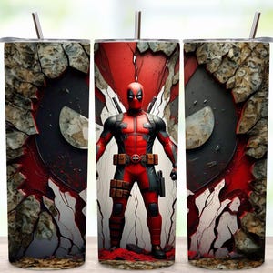 May include: A set of three stainless steel tumblers featuring a Deadpool design. The central tumbler displays the character in a red and black suit, set against a cracked wall background. The other two tumblers show the Deadpool logo.