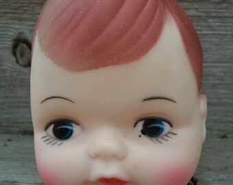 plastic dolls with big heads