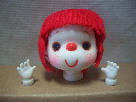 doll with red yarn hair