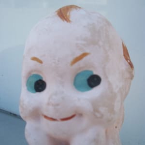 Vintage Ceramic Sitting Kewpie Cupid Doll  **