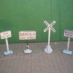 Four-Piece Lot of Vintage Metal Signs for Model Railroading