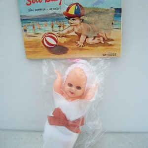 Packaged Vintage French Plastic Strung Baby Bunting Doll by Soco Baby SX-10232 **