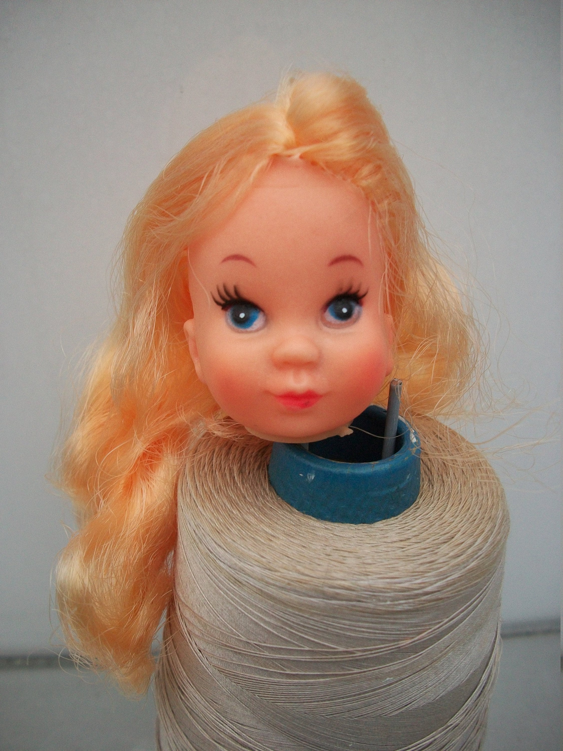 Girl Doll Head With Gold Blonde Hair on a Stick