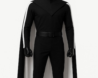 May include: A black jumpsuit with a high collar, black gloves, and black boots. The outfit includes a black cape with white lining and white stripes down the sleeves. A black belt cinches the waist. The outfit is displayed on a mannequin.