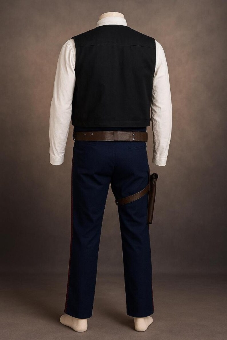 May include: A costume featuring a black vest over a white long-sleeve shirt, paired with navy blue pants with a red stripe. A brown belt and holster complete the outfit. The costume is designed to resemble a character from a science fiction film.