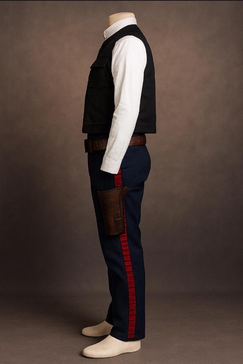 May include: A costume consisting of a black vest, white shirt, and navy blue pants with a red stripe. A brown holster and belt complete the outfit. The costume is displayed on a mannequin.