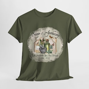 May include: Green t-shirt with a vintage-style illustration of a mortar and pestle, bottles, and herbs. The text reads "Snape's Apothecary" and "Ingredients You Can Trust. Est. 1978."
