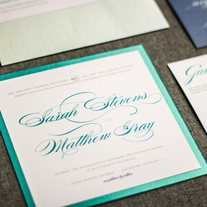May include: A teal and white wedding invitation with the names "Sarah Stevens" and "Matthew Gray" written in cursive script.