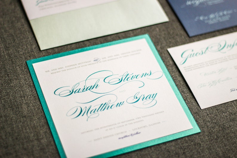 May include: A teal and white wedding invitation with the names "Sarah Stevens" and "Matthew Gray" written in cursive script.