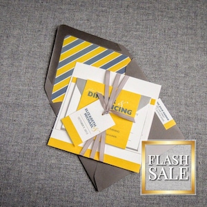 May include: A yellow and gray wedding invitation with a gray envelope. The invitation features a yellow and gray striped pattern and the text "Elizabeth & Michael" and "October 7, 2017".