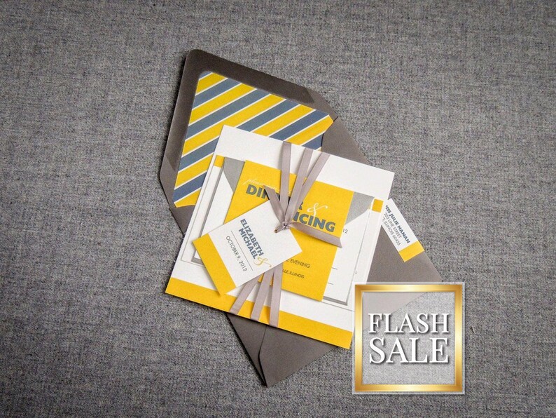 May include: A yellow and gray wedding invitation with a gray envelope. The invitation features a yellow and gray striped pattern and the text "Elizabeth & Michael" and "October 7, 2017".