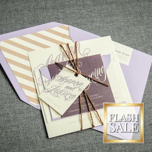 May include: A wedding invitation suite with a purple and cream striped envelope, a cream card with the text "Aaron and Jessica" and the date "July 8, 2018", and a purple and cream card with the text "Our Wedding Ceremony" and a floral design.