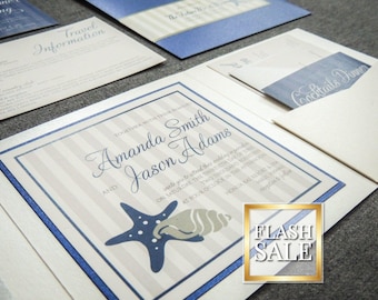 May include: Wedding invitation suite with a nautical theme. The invitation features a blue starfish and seashell design on a striped background. Additional cards include travel information and a cocktail dinner card.