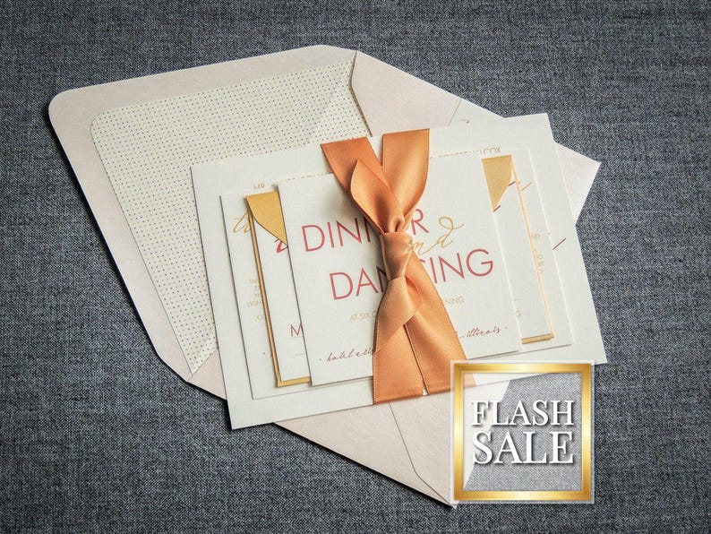 May include: A set of wedding invitations with a peach-colored ribbon and gold accents. The invitation reads "Dinner and Dancing". The text "Flash Sale" is visible in the lower right corner.