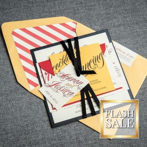 May include: A wedding invitation suite with a yellow, red, and black color scheme. The invitation features the text "Barron and Jessica" and "July 6, 2013". The RSVP card has the text "Cocktails and Dancing".