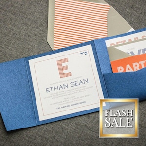 May include: Blue invitation card with a white inner card featuring the name Ethan Sean and a red and white letter E. The card has a pocket for a smaller card with the text "Details" and "Party" in orange and white.
