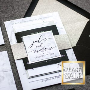 May include: Wedding invitation suite with a black and white marble design. The invitation features the text "Please join us for Julia and Marcus, December 7, 2018".