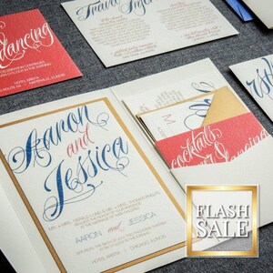 May include: A wedding invitation suite with a gold and white design. The invitation features the names "Aaron and Jessica" in blue and red script. The RSVP card is in blue script on a white background. The inner envelope is red with the text "Cocktails & Dinner Dancing" in white script.