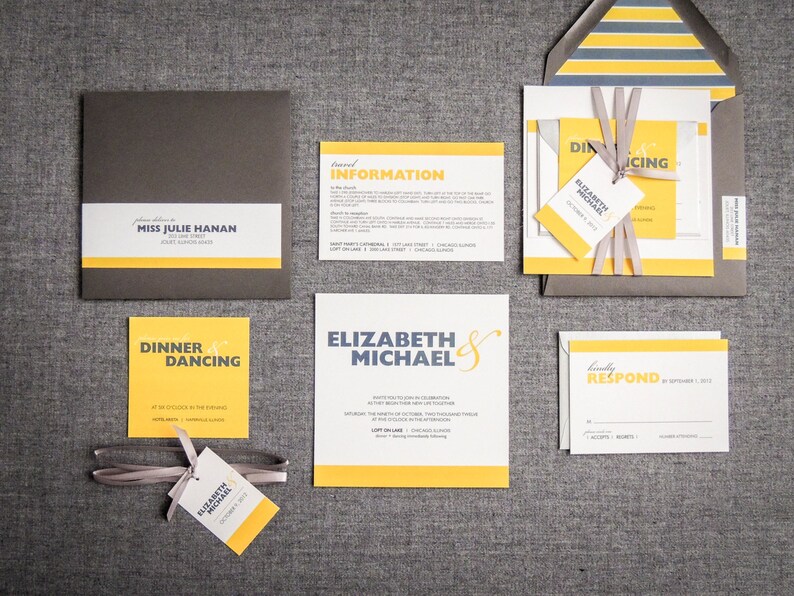 May include: A wedding invitation suite with yellow and gray accents. The invitation features the couple's names, "Elizabeth & Michael", in a bold, blue font. The RSVP card includes the text "Kindly Respond by September 1, 2012".