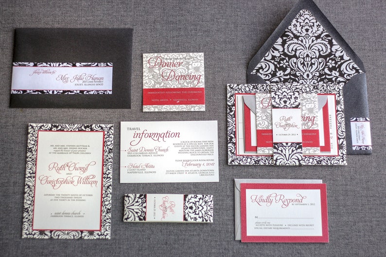 May include: A set of wedding invitations with black and white damask patterns, red accents, and the text "Ruth Cheryl and Christopher William".