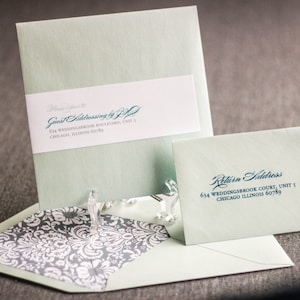 May include: A light green envelope with a white label that says "Guest Addressing by J.P." and a return address label that says "634 Weddingbrook Court, Unit 5, Chicago Illinois 60789".