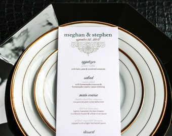 Puede incluir: Una tarjeta de menú de boda con ribete dorado y un diseño decorativo. El menú incluye aperitivos, ensalada, plato principal y postre. El texto en la tarjeta dice "meghan & stephen" y "septiembre 12, 2017".