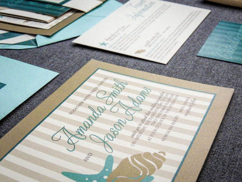 May include: A wedding invitation with a brown and white striped background. The invitation features a seashell and starfish design with the text "Amanda Smith and Jason Adams" in teal blue script.
