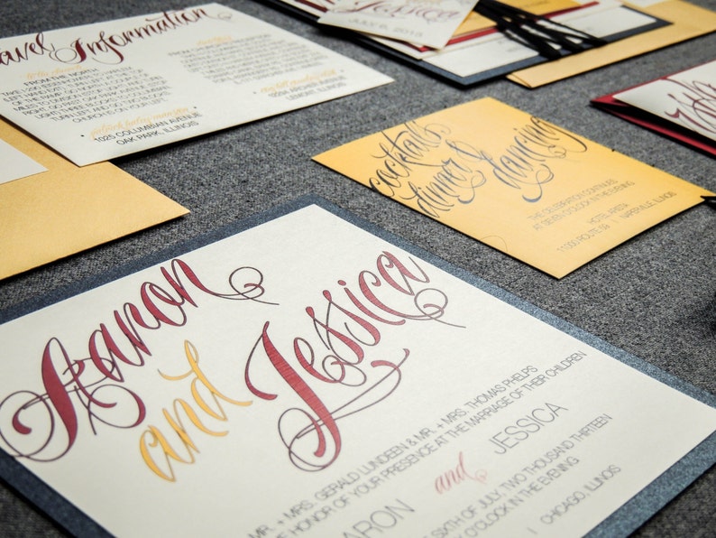 May include: Wedding invitation suite with a cream background and burgundy and gold lettering. The invitation reads "Aaron and Jessica" with the date and time of the wedding.