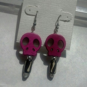 Purple skull sitting on black and white swirl bead wire dangle handmade earring