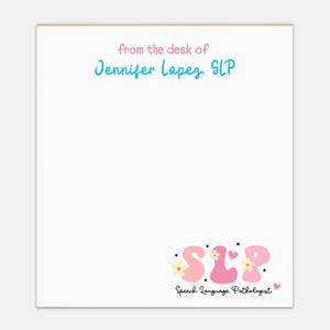 May include: White notepad with the text "from the desk of Jennifer Lopez, SLP" in pink and teal. The bottom of the notepad features the letters "SLP" in pink with floral and heart accents, and the words "Speech Language Pathologist".