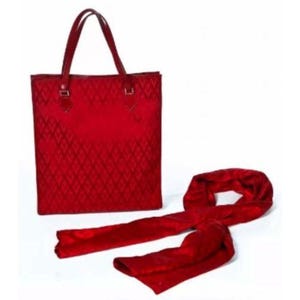 May include: A red tote bag and scarf set. The tote bag has a diamond pattern and two handles. The scarf is long and flowing. The set is a vibrant shade of red.