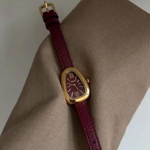 Snake Head-horloge – kastanjebruine leren band uurwerk met gouden Romeinse cijfers, vintage horloge