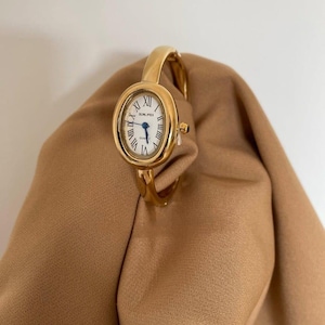Pulsera de cuarzo para mujer, estilo vintage, elegante, en oro y plata, diseño vintage.