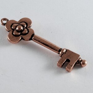 Vintage Copper Tone Metal Skeleton Key Charm Pendant Flower