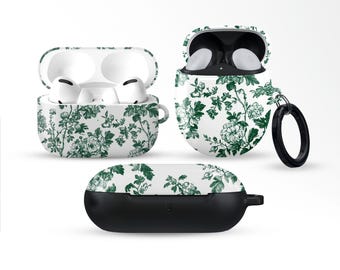 May include: White and green floral patterned earbud cases. The cases are open and closed, showcasing the earbuds inside. The design features a dark green floral pattern on a white background. One case has a black ring attached.