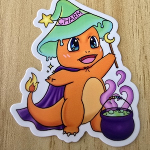 May include: A cartoon illustration of a orange and yellow Pokemon character wearing a green and purple witch hat with the word "CHARM" on it. The character is holding a wand with a crescent moon on top. The character is also wearing a purple cape and has a cauldron with green liquid next to it.