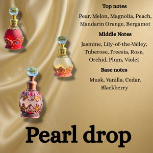 May include: Three decorative perfume bottles with ornate designs and jewel-toned colors are displayed against a golden background. The bottles have a pearlescent finish and are topped with crystal-like stoppers. The text "Pearl drop" is at the bottom of the image.