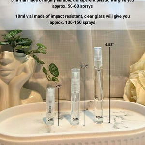 May include: Three clear spray vials of varying sizes (2ml, 5ml, and 10ml) are displayed on a white oval tray. The 2ml vial is 2.2 inches tall, the 5ml is 3.35 inches, and the 10ml is 4.58 inches. Text indicates the number of sprays each vial provides.