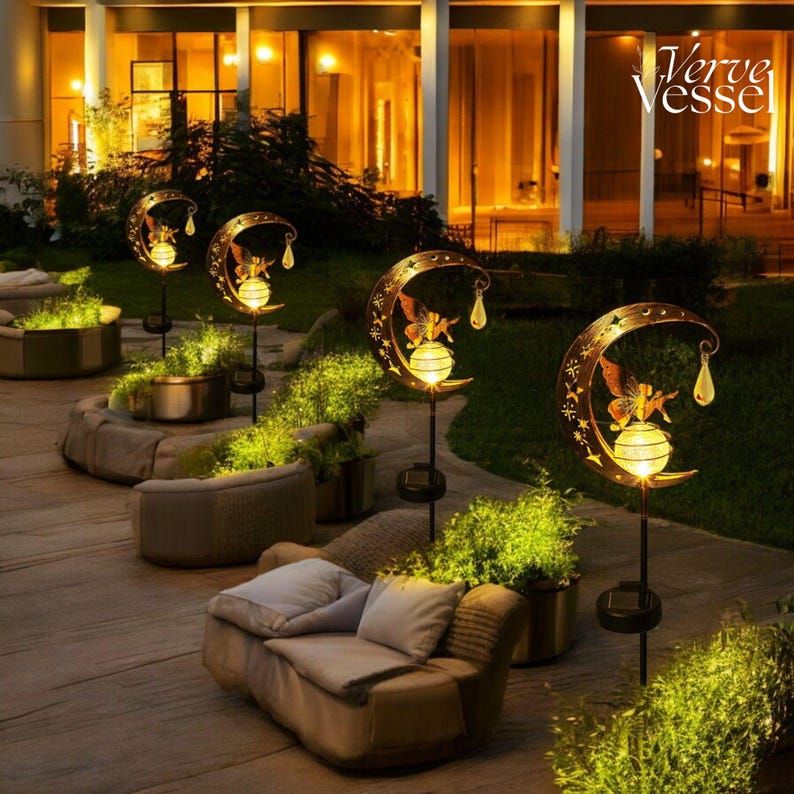 Solar moon fairy garden light with crackle glass globe and warm LED glow, eco-friendly outdoor stake lamp powered by solar panel, durable iron frame with waterproof IP65 design, 800mAh rechargeable battery for 10–12 hours of light, height 84 cm and width 16 cm, perfect for garden pathways, patios, balconies, or yard decoration, whimsical moon fairy design adds charm to outdoor spaces, energy-saving solar garden decor, great gift for garden lovers, birthdays, or housewarmings.
