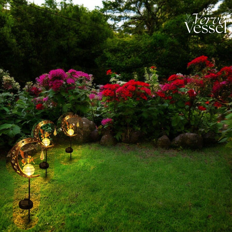 Solar moon fairy garden light with crackle glass globe and warm LED glow, eco-friendly outdoor stake lamp powered by solar panel, durable iron frame with waterproof IP65 design, 800mAh rechargeable battery for 10–12 hours of light, height 84 cm and width 16 cm, perfect for garden pathways, patios, balconies, or yard decoration, whimsical moon fairy design adds charm to outdoor spaces, energy-saving solar garden decor, great gift for garden lovers, birthdays, or housewarmings.