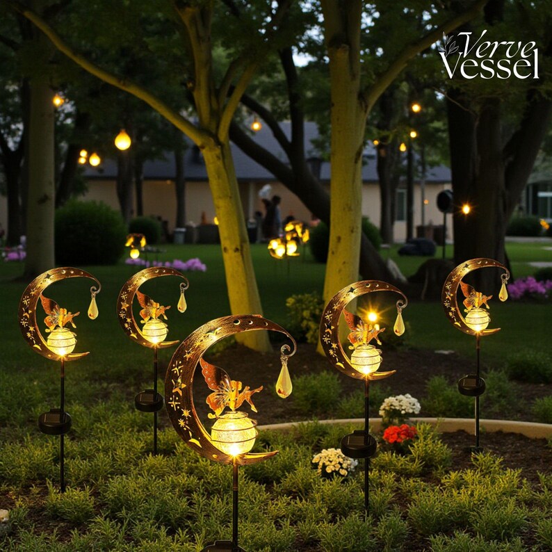 Solar moon fairy garden light with crackle glass globe and warm LED glow, eco-friendly outdoor stake lamp powered by solar panel, durable iron frame with waterproof IP65 design, 800mAh rechargeable battery for 10–12 hours of light, height 84 cm and width 16 cm, perfect for garden pathways, patios, balconies, or yard decoration, whimsical moon fairy design adds charm to outdoor spaces, energy-saving solar garden decor, great gift for garden lovers, birthdays, or housewarmings.