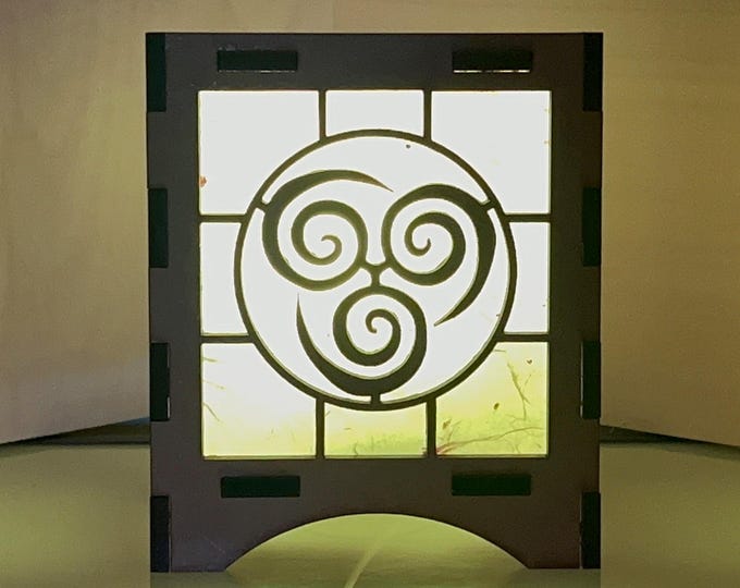 Handcrafted Japanese-style Wooden Lantern with natural elemental design and fire-like glow and handmade paper