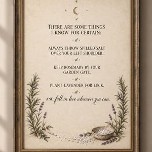 May include: A framed wall art print on aged paper featuring a crescent moon icon and the text: THERE ARE SOME THINGS I KNOW FOR CERTAIN: ALWAYS THROW SPILLED SALT OVER YOUR LEFT SHOULDER. KEEP ROSEMARY BY YOUR GARDEN GATE. PLANT LAVENDER FOR LUCK, AND fall in love whenever you can. The print is decorated with illustrations of lavender sprigs and a small bowl of salt.
