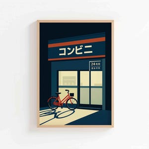 May include: A framed art print featuring a stylized illustration of a Japanese convenience store, with the Japanese word "Konbini" above the entrance. A red bicycle is parked in front of the store, casting a shadow.