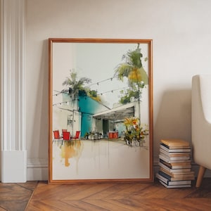 May include: Framed watercolour print of an architectural scene. The artwork shows an outdoor patio with red chairs, palm trees, and fairy lights. The colour scheme includes teal, white, and brown tones, creating a relaxed atmosphere.