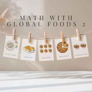 May include: A display of cards clipped to a string with wooden clothespins. Each card features a different global food illustration: Varenyky, Tahchin, Kleicha, Baklava, and Ful Medames. The text "MATH WITH GLOBAL FOODS 2" is at the top.