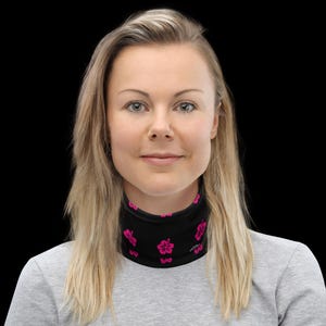 May include: A black neck gaiter featuring a repeating pattern of small, vibrant pink hibiscus flowers. The fabric is smooth and form-fitting, designed to cover the neck area completely with a consistent floral print throughout the entire surface.