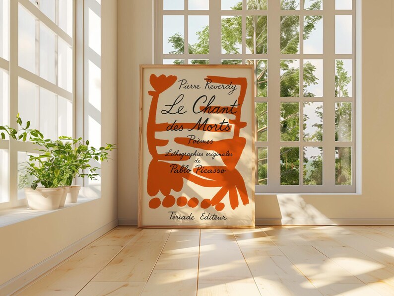 May include: A vintage book cover with an orange abstract design and the text "Pierre Reverdy Le Chant des Morts Poemes Lithographies originales de Pablo Picasso  Teriade Editeur".