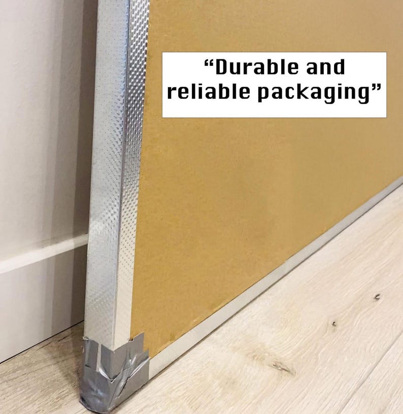 May include: Close-up of a cardboard box with a silver edge and tape. The box is labeled "Durable and reliable packaging."