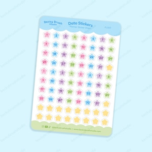 May include: A sheet of planner stickers titled Date Stickers by Becky Brush studio, featuring rows of pastel-coloured star-shaped icons numbered 1 through 31 in repeating patterns, plus extra blank yellow stars at the bottom on a white background.